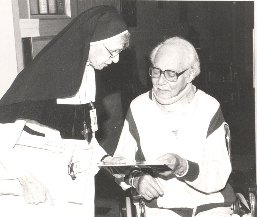 Mother Aquila and a patient at St. John's Rehab Hospital.
